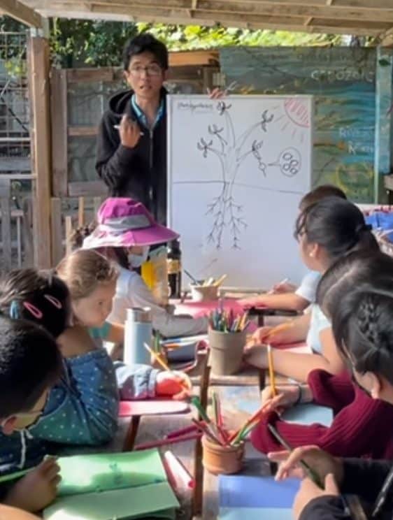 Youth Corps member teaching TEACHIN Nature curriculum, an outdoor STEAM education program at ELSEE, a certified outdoor classroom