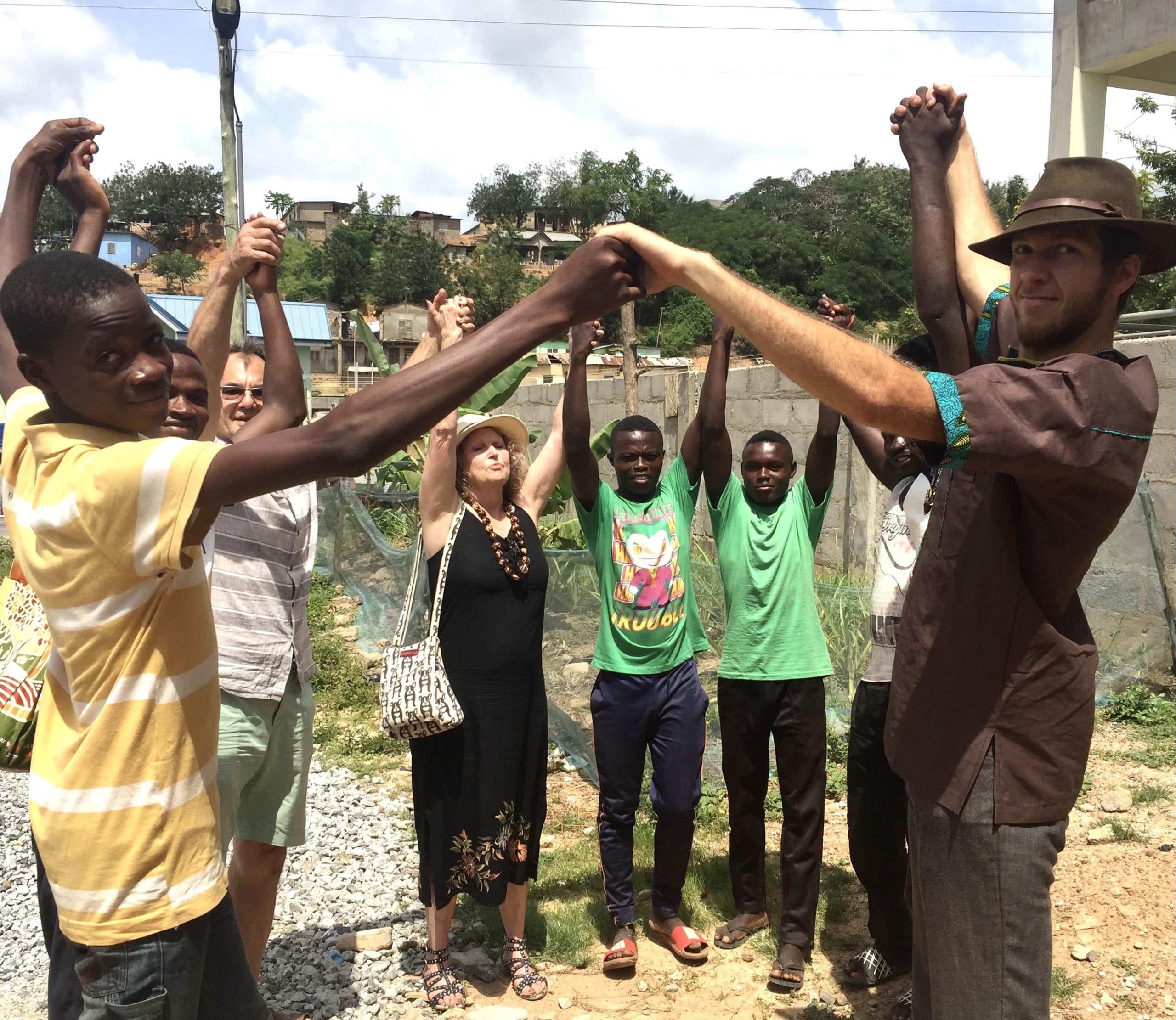 Green Club members, CNGF volunteers and Ms. Middlebrook joining hands and hearts for solidarity in celebration for future success of Garden for Ghana, in 2019 on our last visit to Ghana before COVID
