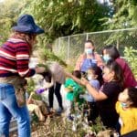 Children and Teachers Planting Vegetables at Educare SV Teaching Garden